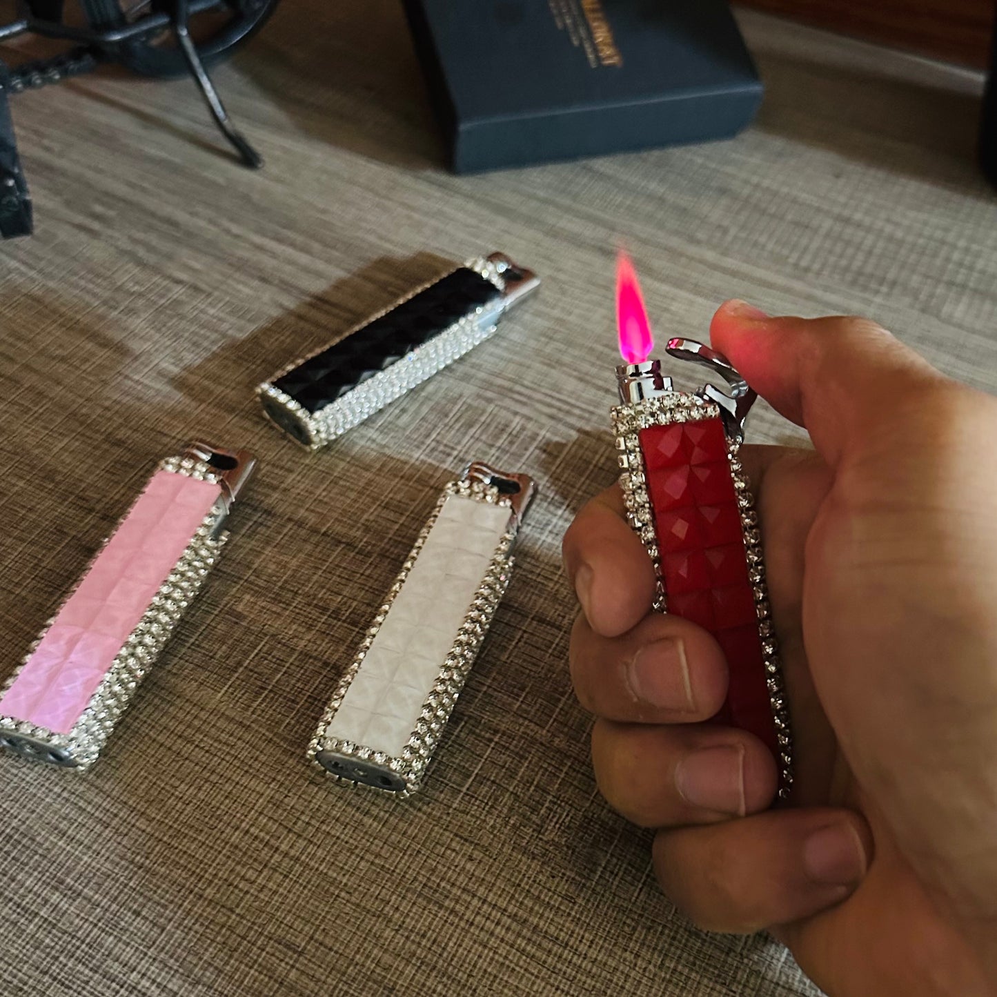 Diamond-shaped Lighter With a Red Flame